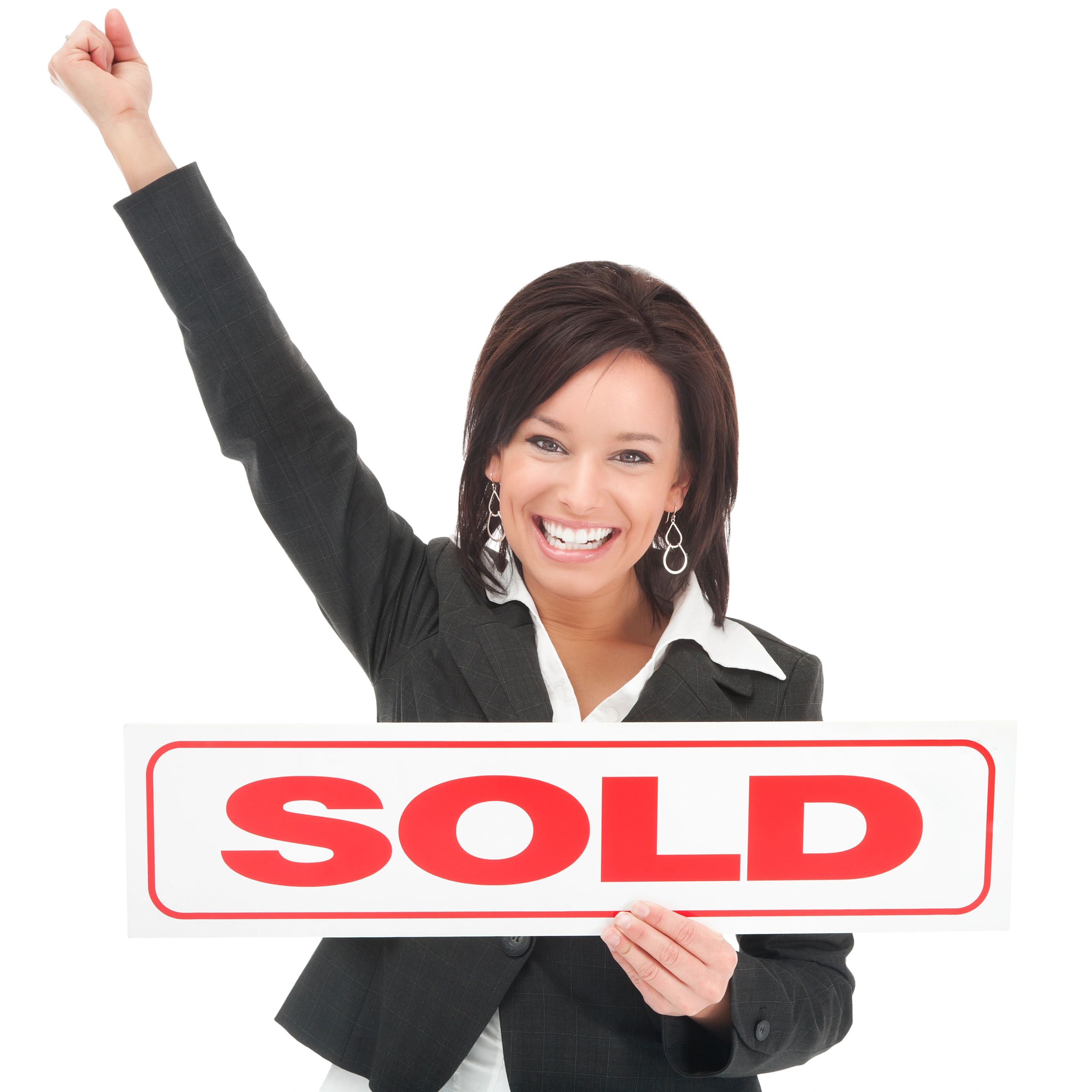 Real estate agent holding a sold sign