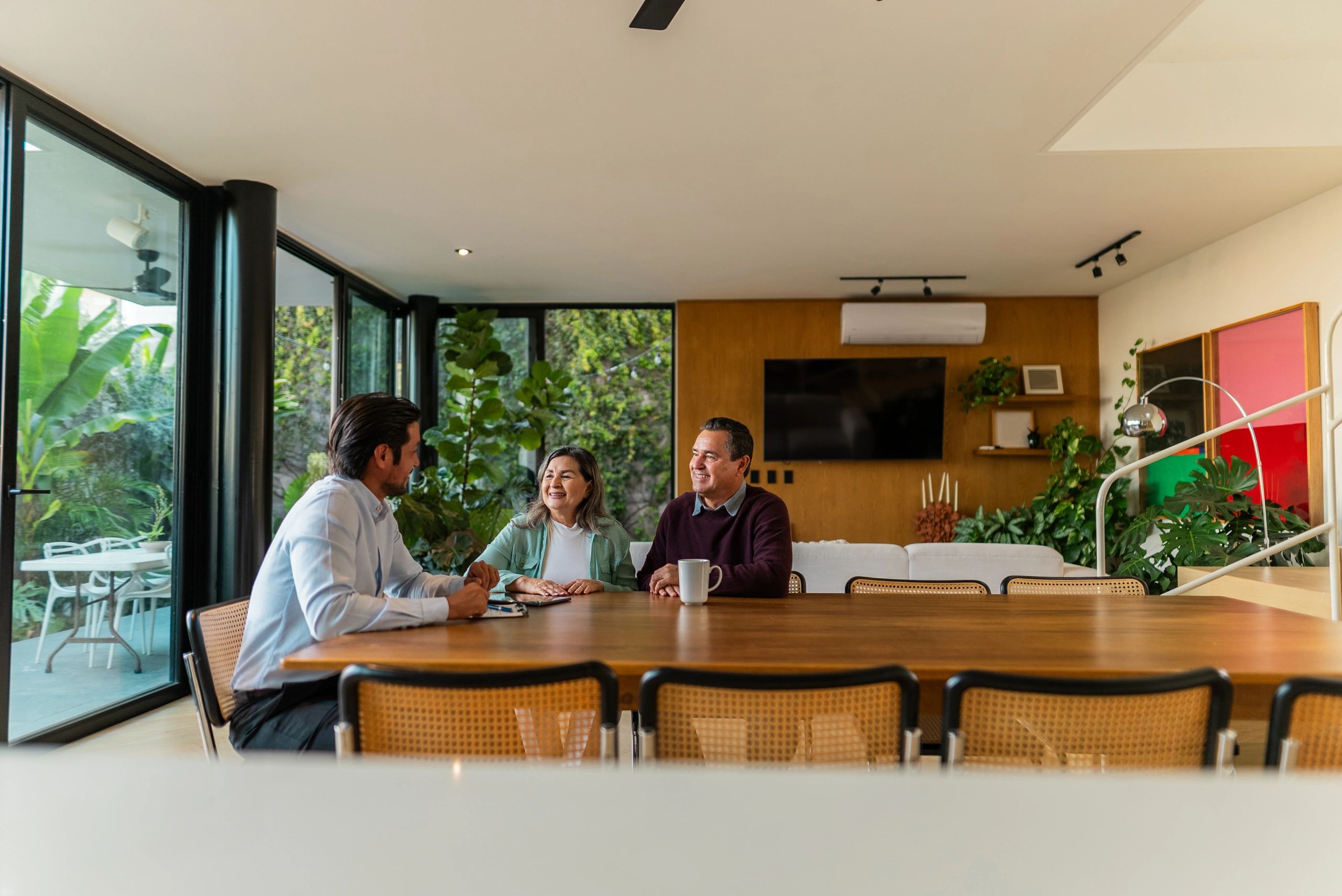 Real estate agent meeting with clients at a home