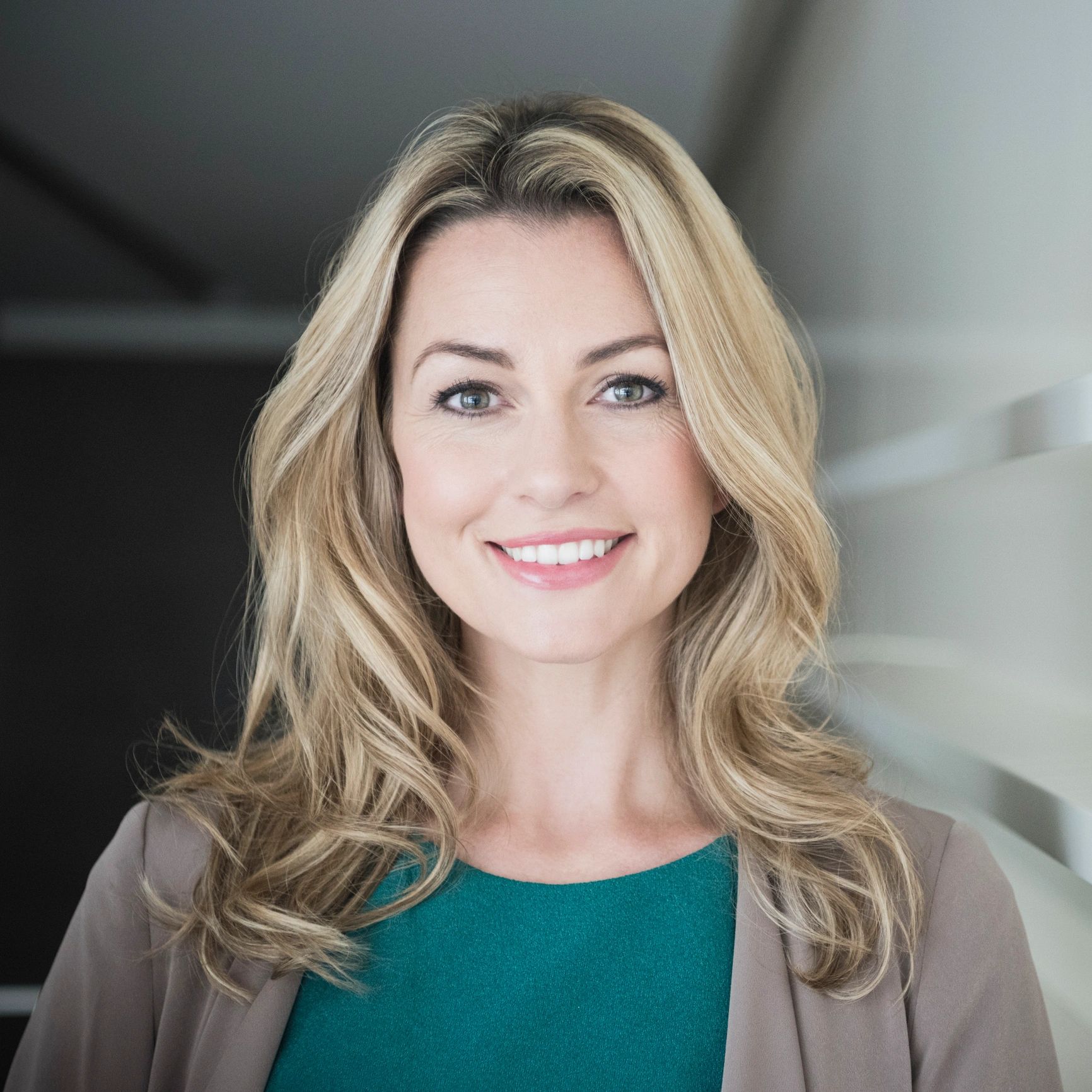Portrait headshot of a smiling woman