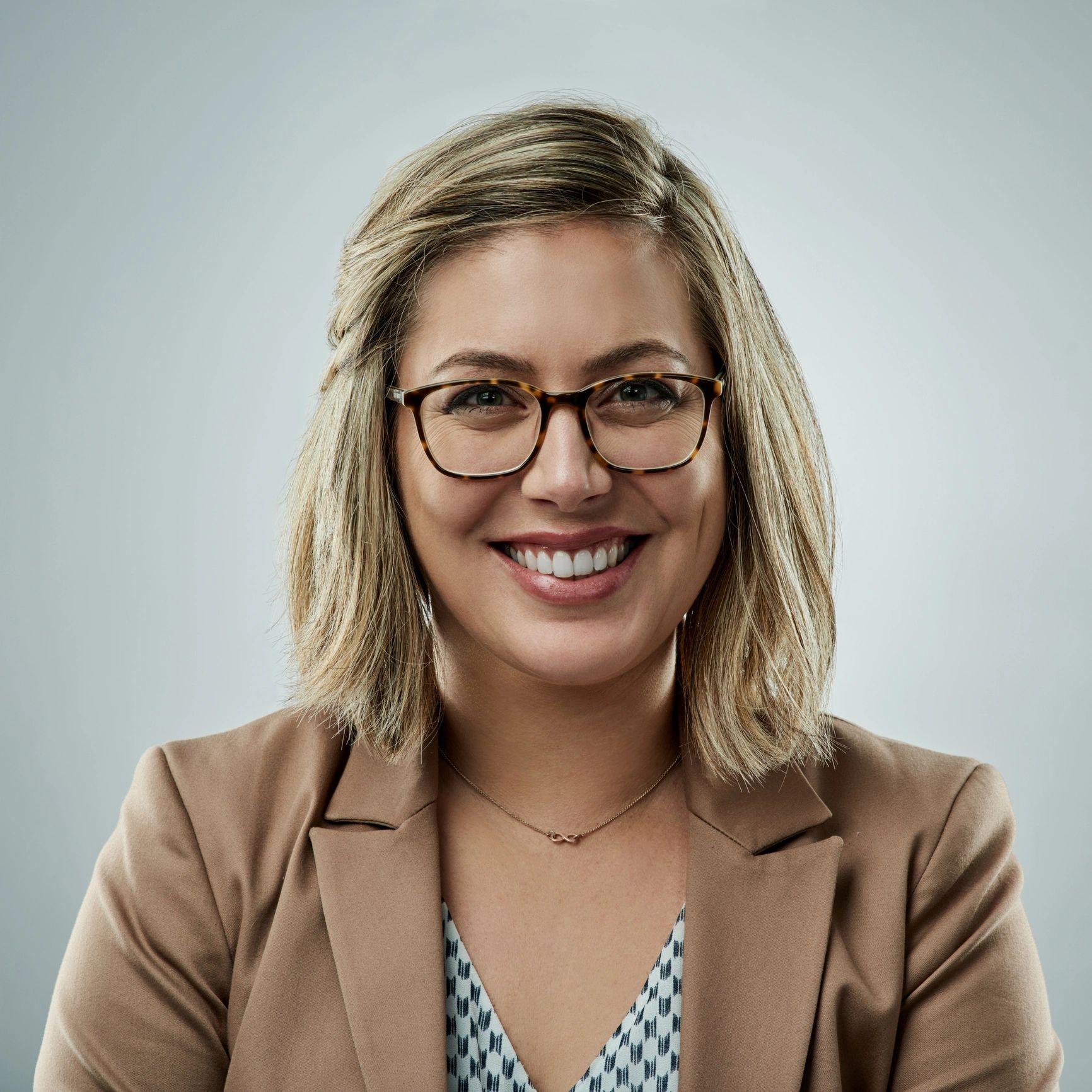 Professional headshot of a real estate agent